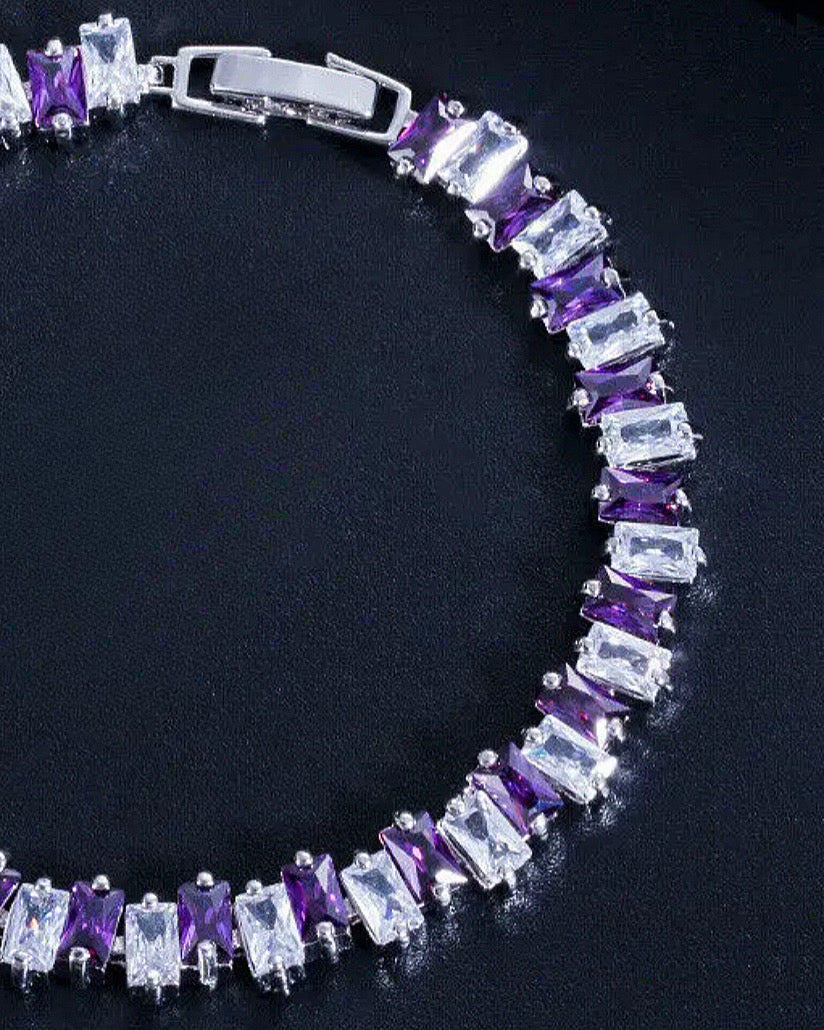 A purple and white rectangular diamond patterned tennis bracelet