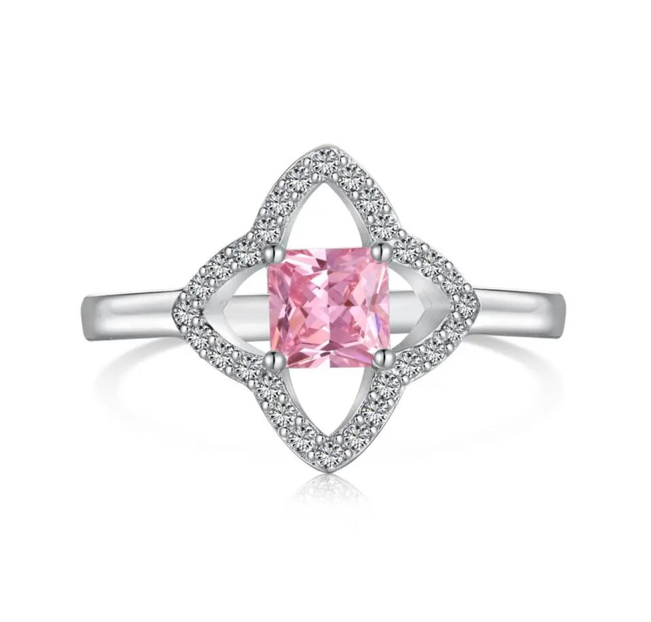 This is a 4 leaf clover like silver plated ring with miniature cz embroidery diamonds around the clover petals and a mini pink central square diamond inside the clover at the front/top of the ring