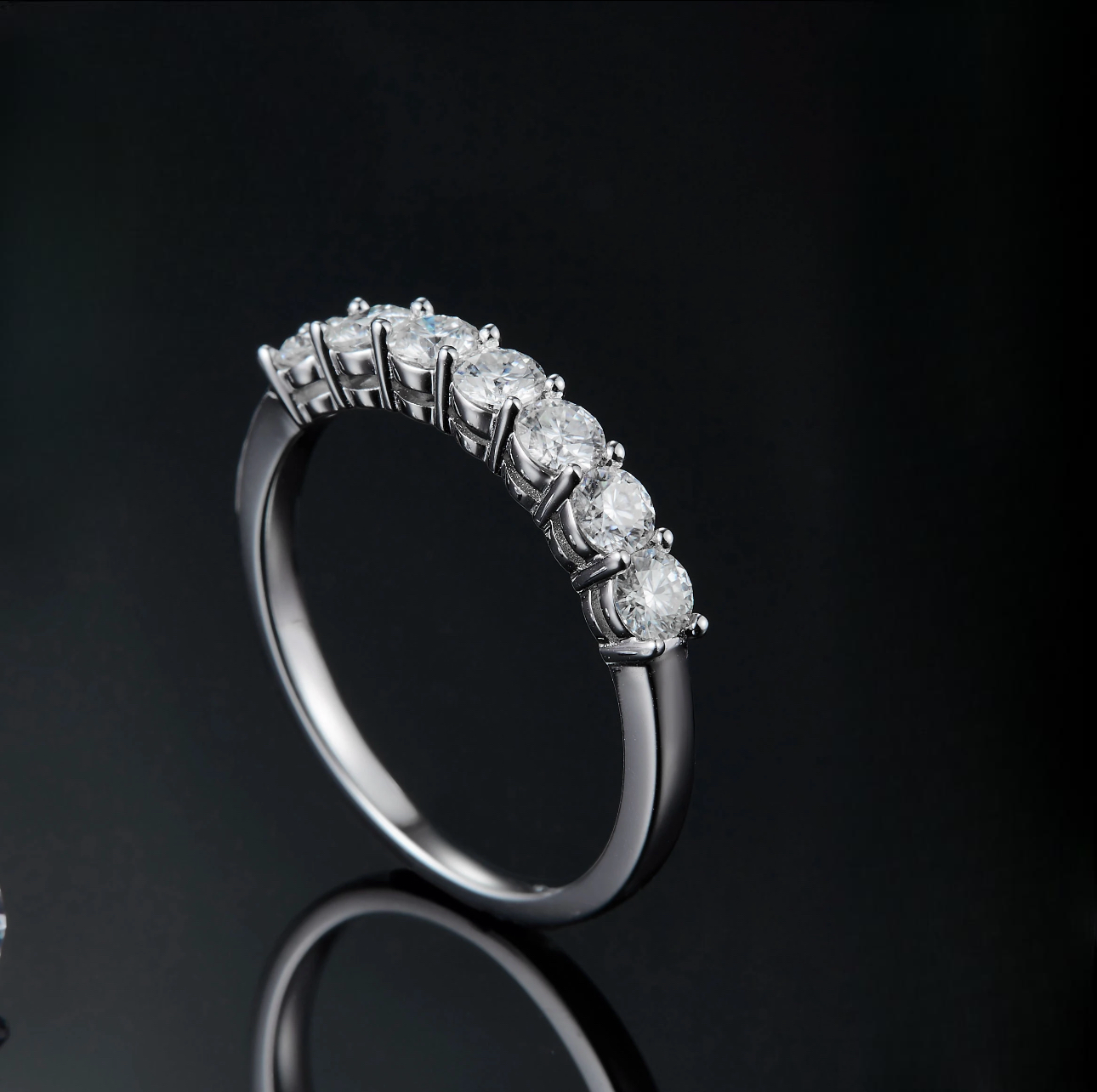 A silver plated ring with 925 inscription. This ring has mini circular cz diamonds
