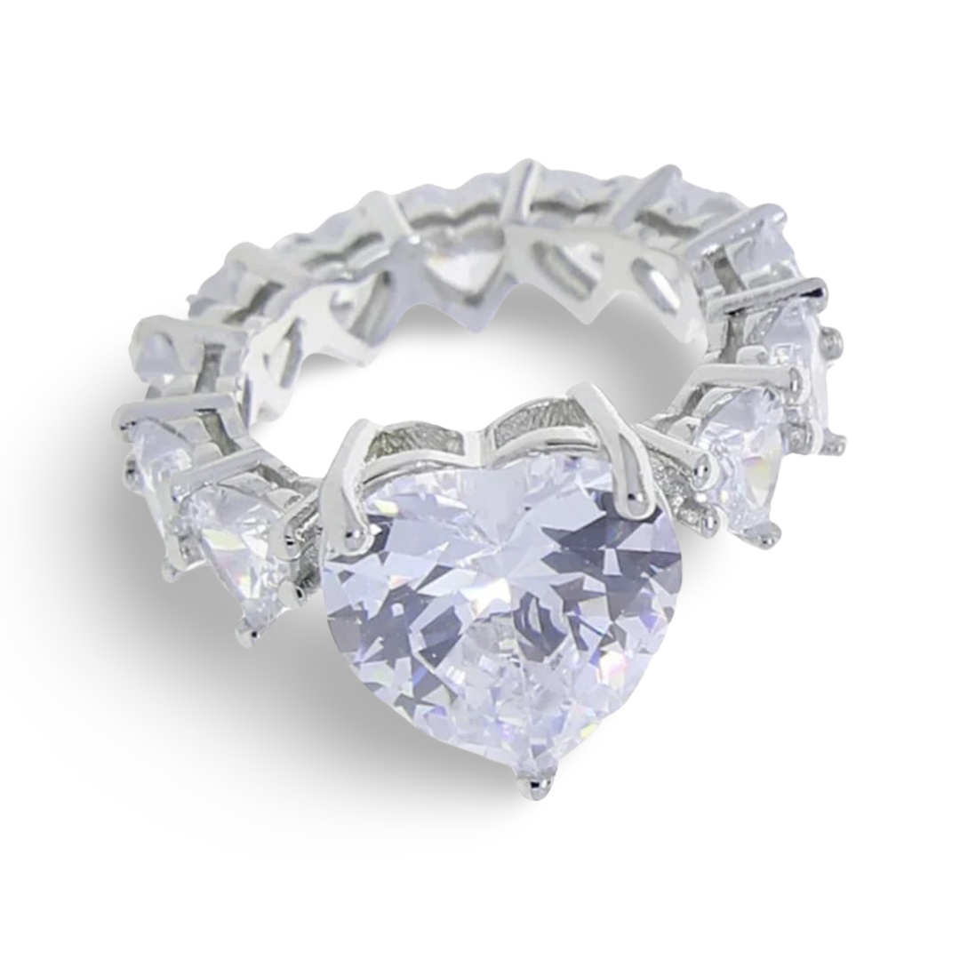 A medium white large heart shaped central cz diamond ring with mini white heart shaped diamonds surrounding the rest of the ring. The ring has silver plating, essentially an all heart ring so no band is showing 