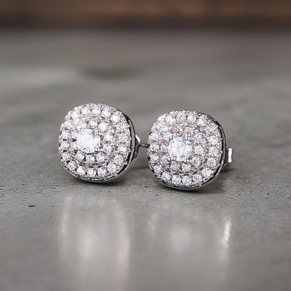 Curved square like studs with mini circular embroidery cz diamonds making up the front of the earring pair. These are all white diamonds followed by silver plating 