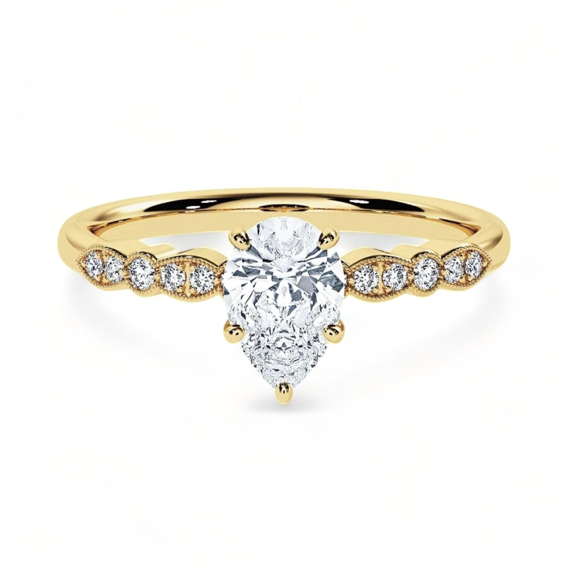 A gold plated ring with a mini white pear shaped diamond as the central piece followed by very miniature white embroidery diamonds to each side of the pear central piece. The miniature diamonds only go to the sides partially, not all around the band so the gold band is still visible particularly at the back of the ring 